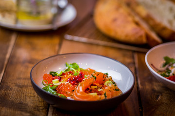 assorted salads in mediterranean restaurant  with focaccia bread in background