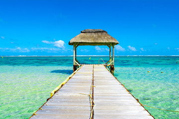 Tropical landscape with wooden pier