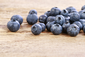 Blueberries on wooden background, copy space.