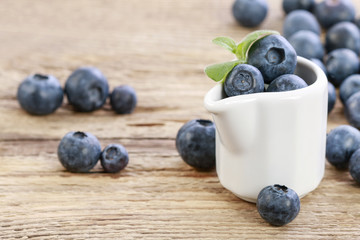 Blueberries in ceramic jug