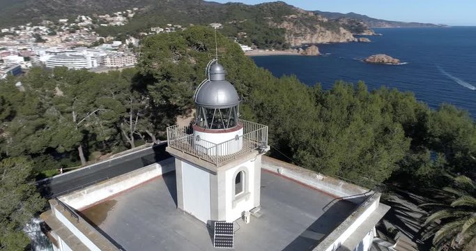 360 drone flight around a lighthouse in Tossa de Mar, on the coast of the Mediterranean Sea