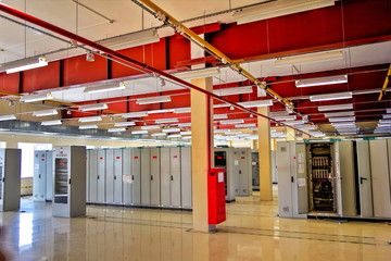 Switchgear room with cabinets with network hardware