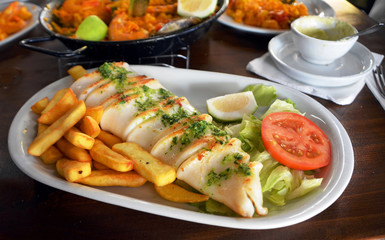 The grilled squid dish is of the Mediterranean cuisine.