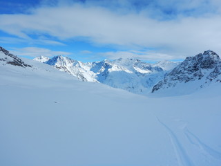 Obraz premium skitouring in beautiful snowy alps