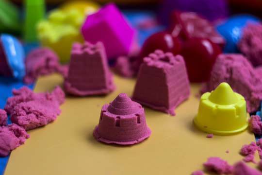 Pink kinetic sand, educational game for children. The development of motor skills in boys and girls