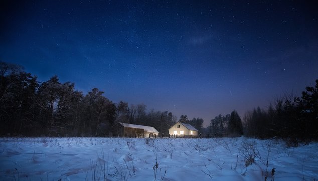 Calm night in polish countryside. House near forest