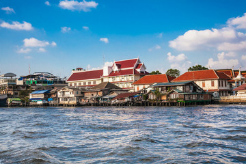 Old Thai traditional houses at Chao Phraya River in Bangkok Thailand.