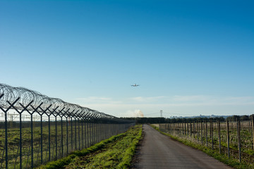 Horizontal View of a Cargo Airplane in the Landing Operation in the Morning. Grottaglie, Taranto, South of Italy