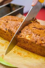 Chef's Knife Cutting Loaf of Apple Bread
