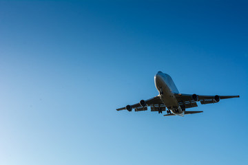 Horizontal View of a Cargo Airplane in the Landing Operation in The Morning. Grottaglie, Taranto, South of Italy
