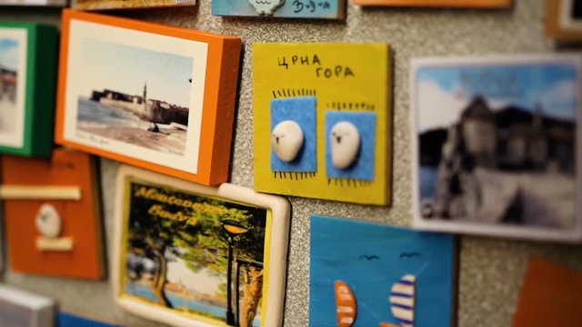 Close up of the different funny pictures and fridge magnets for tourists .in the souvenirs shops.