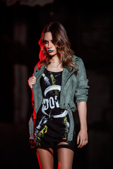 urban girl posing at night mean look