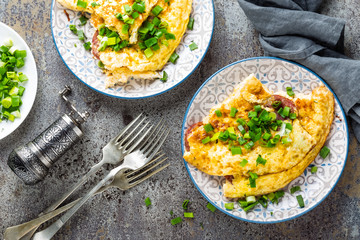 Omelet or omelette with fresh green onion, scrambled eggs