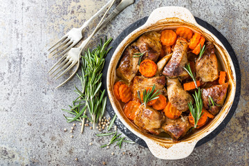 Meat baked with carrots in the oven