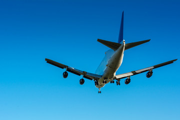 Horizontal View of Close Up of a Cargo Airplane in the Landing Operation in The Morning. Grottaglie, Taranto, South of Italy