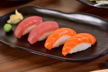 Salmon and Tuna Nigiri Sushis on restaurant table