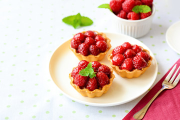 Mini tarts with raspberries fruits