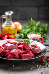 Raw beef meat sliced on black background