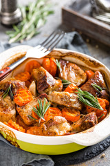 Meat baked with carrots in the oven