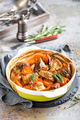 Meat baked with carrots in the oven