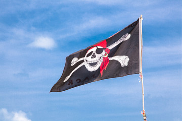 The pirate flag flies to the beach in Phuket, Thailand.
