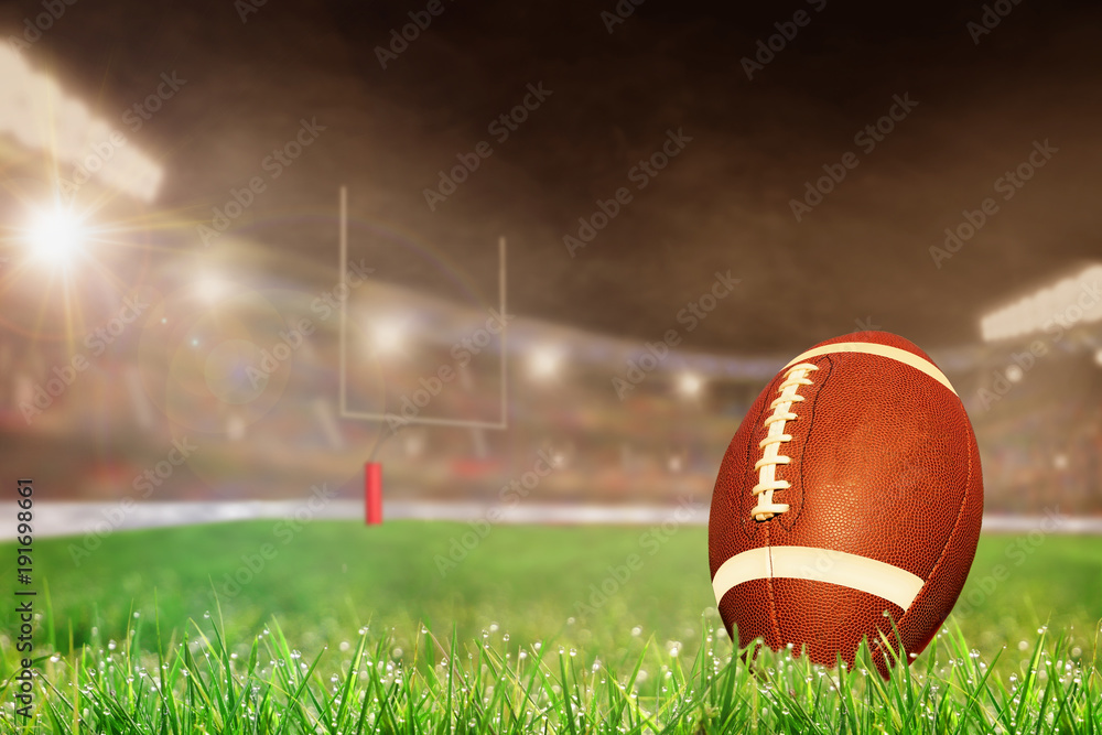 Wall mural Outdoor Football Stadium With Ball on Grass and Copy Space