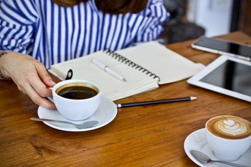 Coffee cup hot in the morning and working at cafe