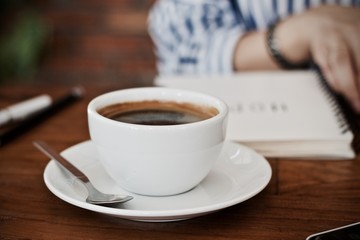 Coffee cup hot in the morning and working at cafe