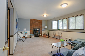 Cozy family room with blue walls and wainscoting