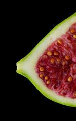 Fig in the shape of a female breast in black background