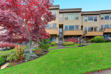 Condominium, apartment building with beige siding