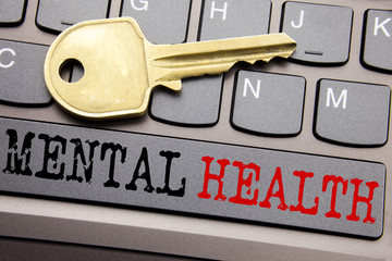 Hand writing text caption inspiration showing Mental Health. Business concept for Anxiety Illness Disorder written on keyboard key on the with key next to the text.