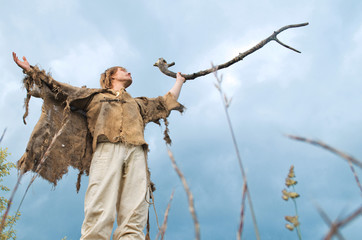 druid causes the rain lifting to the sky a wooden stick