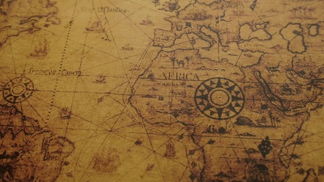 JAKARTA - Indonesia. February 08, 2018: Macro shot of ancient map of the world with compass