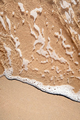 Wave on sandy beach
