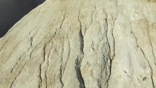 Close-up detail of rough cut miniature rocky cliffs. Nature and adventure concept. warm limestone texture. close up texture of grey stone with cracks