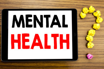 Writing text showing Mental Health. Business concept for Anxiety Illness Disorder written on tablet...