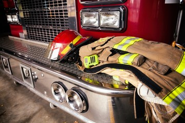 Firefighter gear helmet on a truck - Powered by Adobe