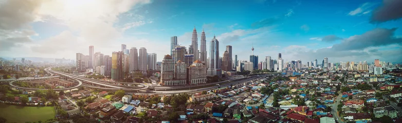 Poster Panorama cityscape view in the middle of Kuala Lumpur city center , early morning with little mist , Malaysia . © jamesteohart