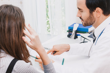 Fototapeta premium Doctor and woman patient consulting on doctors table in hospital.healthcare and medicine