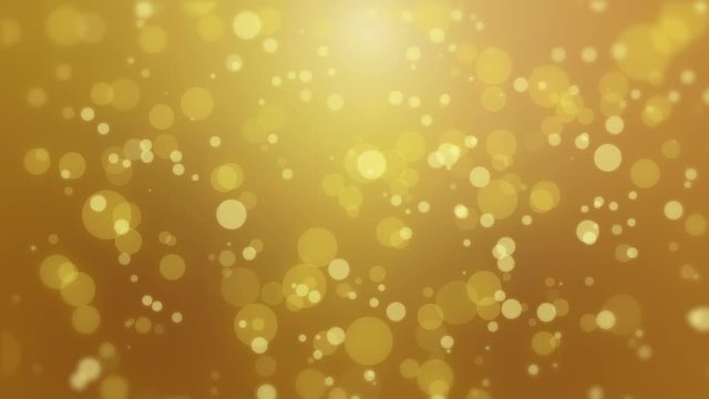 Glowing animated golden yellow bokeh background with floating light particles.