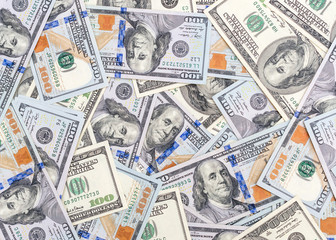 One hundred dollar bills as financial background.
