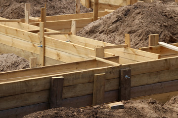Wooden formwork concrete strip foundation for a cottage