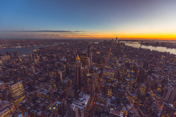 New York City - Manhattan downtown skyline skyscrapers at night - View from Observation Deck on the Empire State Building at twilight. USA.