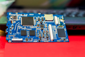 motherboard from a tablet, a workshop for repair and maintenance of equipment