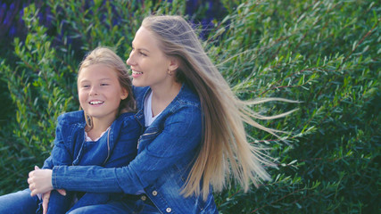 Happy mother and daughter in the park