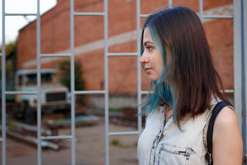 blue haired goth girl walk on abandoned factory