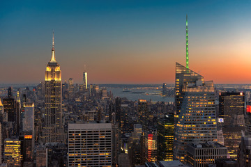 New York City, Manhattan skyline with urban skyscrapers at sunset. 