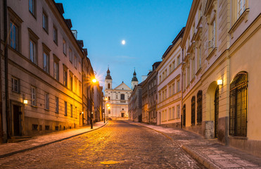 Pauline church of St. Spirit and Mostowa street at night on the old town in Warsaw, Poland