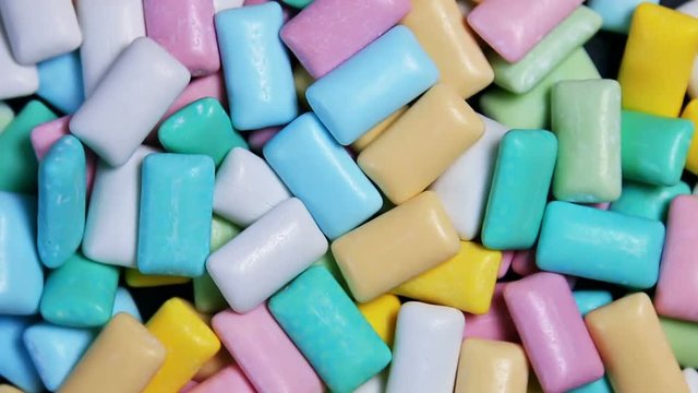 different colors chewing gum pastel color. Background. The video rotation